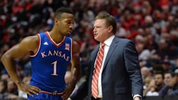 Dec 22, 2015; San Diego, CA, USA; Kansas Jayhawks head coach Bill Self talks to guard Wayne Selden Jr. (1) during the first half against the San Diego State Aztecs at Viejas Arena at Aztec Bowl. Mandatory Credit: Jake Roth-USA TODAY Sports