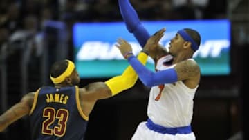 Oct 30, 2014; Cleveland, OH, USA; New York Knicks forward Carmelo Anthony (7) shoots over Cleveland Cavaliers forward LeBron James (23) in the third quarter at Quicken Loans Arena. Mandatory Credit: David Richard-USA TODAY Sports