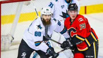 Jan 11, 2016; Calgary, Alberta, CAN; San Jose Sharks defenseman Brent Burns (88) and Calgary Flames left wing Micheal Ferland (79) fight for position during the third period at Scotiabank Saddledome. San Jose Sharks won 5-4. Mandatory Credit: Sergei Belski-USA TODAY Sports
