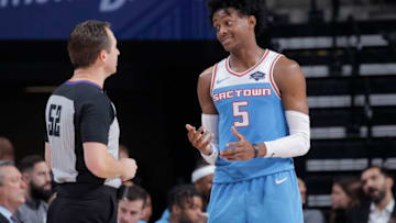 SACRAMENTO, CA - DECEMBER 23: De'Aaron Fox #5 of the Sacramento Kings talks to a referee during the game against the New Orleans Pelicans on December 23, 2018 at Golden 1 Center in Sacramento, California. NOTE TO USER: User expressly acknowledges and agrees that, by downloading and or using this photograph, User is consenting to the terms and conditions of the Getty Images Agreement. Mandatory Copyright Notice: Copyright 2018 NBAE (Photo by Rocky Widner/NBAE via Getty Images)
