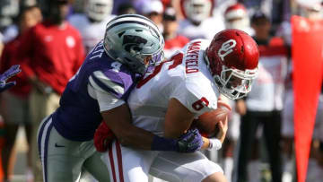 Oct 17, 2015; Manhattan, KS, USA; Oklahoma Sooners quarterback Baker Mayfield (6) is sacked by Kansas State Wildcats defensive back Kaleb Prewett (4) at Bill Snyder Family Football Stadium. Mandatory Credit: Scott Sewell-USA TODAY Sports