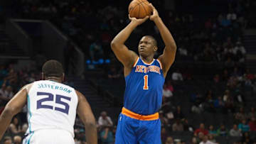 Oct 17, 2015; Charlotte, NC, USA; New York Knicks forward Kevin Seraphin (1) shoots the ball over Charlotte Hornets center Al Jefferson (25) during the first half at Time Warner Cable Arena. Mandatory Credit: Jeremy Brevard-USA TODAY Sports