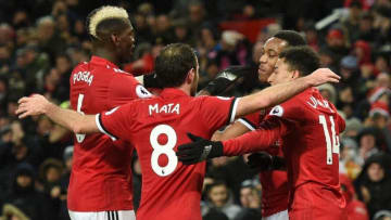 Manchester United's French striker Anthony Martial (2R) celebrates scoring their second goal with Manchester United's French midfielder Paul Pogba (L), Manchester United's Spanish midfielder Juan Mata (2L) and Manchester United's English midfielder Jesse Lingard (R) during the English Premier League football match between Manchester United and Stoke City at Old Trafford in Manchester, north west England, on January 15, 2018. / AFP PHOTO / Oli SCARFF / RESTRICTED TO EDITORIAL USE. No use with unauthorized audio, video, data, fixture lists, club/league logos or 'live' services. Online in-match use limited to 75 images, no video emulation. No use in betting, games or single club/league/player publications. / (Photo credit should read OLI SCARFF/AFP/Getty Images)