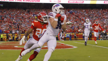 KANSAS CITY, MISSOURI - OCTOBER 16: Dawson Knox #88 of the Buffalo Bills catches a pass in front of Justin Reid #20 of the Kansas City Chiefs to put Buffalo up 23-20 during the fourth quarter at Arrowhead Stadium on October 16, 2022 in Kansas City, Missouri. (Photo by David Eulitt/Getty Images)