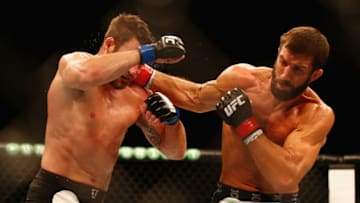 SYDNEY, AUSTRALIA - NOVEMBER 08: Luke Rockhold of the USA (R) connects with a right to the face of Michael Bisping of England in their middleweight fight during the UFC Fight Night 55 event at Allphones Arena on November 8, 2014 in Sydney, Australia. (Photo by Mark Kolbe/Getty Images)