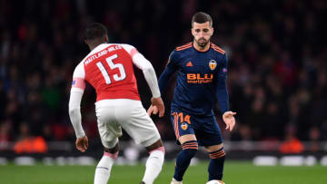 LONDON, ENGLAND - MAY 02: Ainsley Maitland-Niles of Arsenal tackles Jose Luis Gaya of Valencia during the UEFA Europa League Semi Final First Leg match between Arsenal and Valencia at Emirates Stadium on May 2, 2019 in London, England. (Photo by Justin Setterfield/Getty Images,)