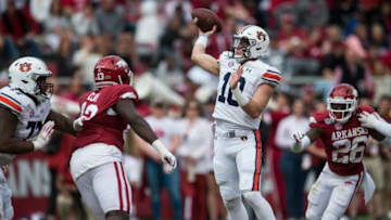 Auburn football quarterback Bo Nix (10) throws the ball for a Auburn wide receiver Seth Williams (18) touchdown at Donald W. Reynolds Razorback Stadium in Fayetteville, Ark., on Saturday, Oct. 19, 2019. Auburn defeated Arkansas 52-10.