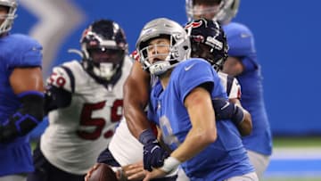 DETROIT, MICHIGAN - NOVEMBER 26: Matthew Stafford #9 of the Detroit Lions is sacked by Nate Hall #48 of the Houston Texans during the second half of a game at Ford Field on November 26, 2020 in Detroit, Michigan. (Photo by Gregory Shamus/Getty Images)