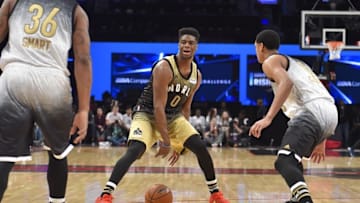 Feb 12, 2016; Toronto, Ontario, CAN; World player Emmanuel Mudiay (0) dribbles the ball in front of U.S player Marcus Smart (36) and U.S. player Jordan Clarkson (6) in the second half during the Rising Stars Challenge basketball game at Air Canada Centre. Mandatory Credit: Bob Donnan-USA TODAY Sports