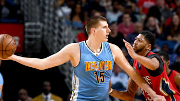 NEW ORLEANS, LA - APRIL 4: Nikola Jokic #15 of the Denver Nuggets looks to pass the ball against the New Orleans Pelicans on April 4, 2017 at the Smoothie King Center in New Orleans, Louisiana. NOTE TO USER: User expressly acknowledges and agrees that, by downloading and or using this Photograph, user is consenting to the terms and conditions of the Getty Images License Agreement. Mandatory Copyright Notice: Copyright 2017 NBAE (Photo by Garrett Ellwood/NBAE via Getty Images)
