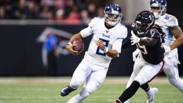 ATLANTA, GA - SEPTEMBER 29: Marcus Mariota #8 of the Tennessee Titans scrambles with the ball during the first half of a game under pressure from De'Vondre Campbell #59 of the Atlanta Falcons at Mercedes-Benz Stadium on September 29, 2019 in Atlanta, Georgia. (Photo by Carmen Mandato/Getty Images)