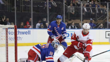 NEW YORK, NEW YORK - MARCH 19: Henrik Lundqvist #30 of the New York Rangers makes the first period save on Dylan Larkin #71 of the Detroit Red Wings at Madison Square Garden on March 19, 2019 in New York City. With playing 18:38 minutes, Lundqvist has played 50,000 minutes in his NHL career and became the third goaltender to accomplish that feat with one franchise in NHL history (Martin Brodeur/New Jersey; Tony Esposito/Chicago). (Photo by Bruce Bennett/Getty Images)