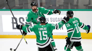 DALLAS, TEXAS - JANUARY 27: Jamie Benn #14 of the Dallas Stars celebrates with Blake Comeau #15 of the Dallas Stars and Joe Pavelski #16 of the Dallas Stars after scoring against the Tampa Bay Lightning in the third period at American Airlines Center on January 27, 2020 in Dallas, Texas. (Photo by Tom Pennington/Getty Images)