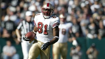 OAKLAND, CA - NOVEMBER 03: Terrell Owens #81 of the San Francisco 49ers runs with the ball during a game against the Oakland Raiders on November 3, 2002 at the Network Associates Stadium in Oakland, California. (Photo by Sporting News via Getty Images)