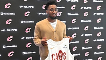 Sep 14, 2022; Cleveland, OH, USA; Cleveland Cavaliers guard Donovan Mitchell poses with his jersey during an introductory press conference at Rocket Mortgage FieldHouse. Mandatory Credit: David Richard-USA TODAY Sports