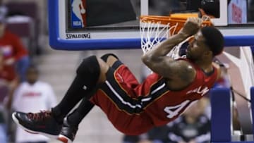 Mar 28, 2014; Auburn Hills, MI, USA; Miami Heat forward Udonis Haslem (40) hangs on the net after dunking in the second half against the Detroit Pistons at The Palace of Auburn Hills. Miami won 110-78. Mandatory Credit: Rick Osentoski-USA TODAY Sports