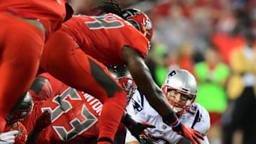 Quarterback Tom Brady #12 of the New England Patriots fumbles the ball during the 3rd quarter of an NFL football game on October 5, 2017 at Raymond James Stadium in Tampa, Florida. (Photo by Julio Aguilar/Getty Images)
