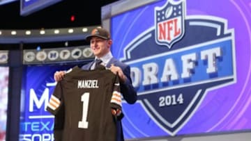 May 8, 2014; New York, NY, USA; Johnny Manziel (Texas A&M) poses with a jersey after being selected as the number twenty-two overall pick in the first round of the 2014 NFL Draft to the Cleveland Browns at Radio City Music Hall. Mandatory Credit: Adam Hunger-USA TODAY Sports
