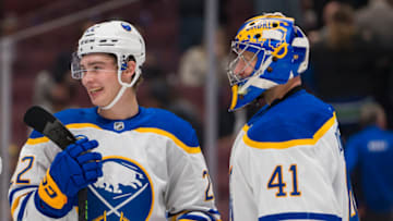 Oct 22, 2022; Vancouver, British Columbia, CAN; Buffalo Sabres forward Jack Quinn (22) and goalie Craig Anderson (41) celebrate their victory against the Vancouver Canucks in the third period at Rogers Arena. Buffalo won 5-1. Mandatory Credit: Bob Frid-USA TODAY Sports