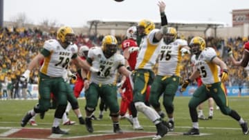 Jan 10, 2015; Frisco, TX, USA; North Dakota State Bison quarterback Carson Wentz (11) celebrates scoring the winning touchdown against the Illinois State Redbirds in the Division I championship at Pizza Hut Park. North Dakota State beat Illinois State 29-27. Mandatory Credit: Tim Heitman-USA TODAY Sports
