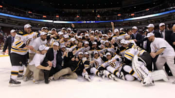VANCOUVER, BC - JUNE 15: The Boston Bruins pose with the Stanley Cup after defeating the Vancouver Canucks in Game Seven of the 2011 NHL Stanley Cup Final at Rogers Arena on June 15, 2011 in Vancouver, British Columbia, Canada. The Boston Bruins defeated the Vancouver Canucks 4 to 0. (Photo by Bruce Bennett/Getty Images)