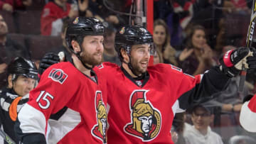 Dec 17, 2016; Ottawa, Ontario, CAN; Ottawa Senators centers Zack Smith (15) and Derick Brassard (19) celebrate a goal scored in the second period against the New Jersey Devils at the Canadian Tire Centre. Mandatory Credit: Marc DesRosiers-USA TODAY Sports