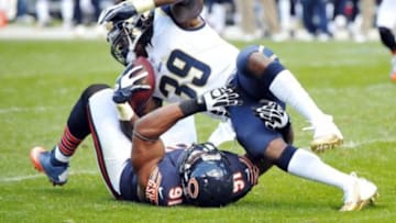 Sep 23, 2012; Chicago, IL, USA; St. Louis Rams running back Steven Jackson (39) is tackled by Chicago Bears defensive tackle Amobi Okoye (91) during the second half at Soldier Field. The Bears won 23-6. Mandatory Credit: Rob Grabowski-USA TODAY Sports