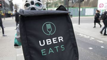 UberEATS delivery bike box in London, England, United Kingdom. Uber Eats is an on-demand meal delivery service powered by the Uber app. It is one of the first expansion products by Uber Technologies Inc., the technology platform that connects drivers and riders, and utilizes its existing network to deliver meals in minutes. The online food ordering service partners with local restaurants in selected cities around the world and allows customers to order meals using the Uber smartphone application. Delivery time is claimed to be 10 minutes or less. (photo by Mike Kemp/In Pictures via Getty Images)