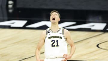 Mar 12, 2021; Indianapolis, Indiana, USA; Michigan Wolverines guard Franz Wagner (21) reacts to making a three point basket against the Maryland Terrapins in the second half at Lucas Oil Stadium. Mandatory Credit: Aaron Doster-USA TODAY Sports