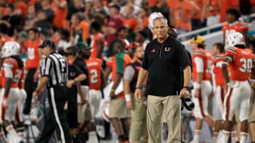 MIAMI GARDENS, FL - OCTOBER 08: Miami Hurricanes head coach Mark Richt tries to calm the fans after throwing debris on the field during a game against the Florida State Seminoles at Hard Rock Stadium on October 8, 2016 in Miami Gardens, Florida. (Photo by Mike Ehrmann/Getty Images)