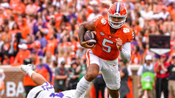 Sep 10, 2022; Clemson, South Carolina, USA; Clemson Tigers quarterback D.J. Uiagalelei (5) runs against Furman Paladins linebacker Luke Clark (44) during the second quarter at Memorial Stadium. Mandatory Credit: Ken Ruinard-USA TODAY Sports