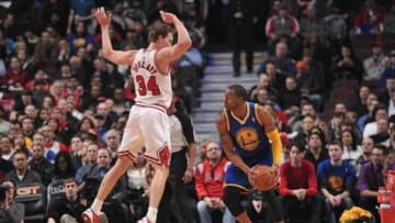 Feb 26, 2014; Chicago, IL, USA; Golden State Warriors small forward Andre Iguodala (9) is defended by Chicago Bulls small forward Mike Dunleavy (34) during the first quarter at the United Center. Mandatory Credit: Rob Grabowski-USA TODAY Sports