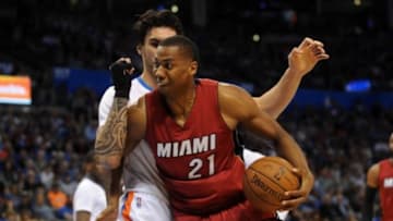 Mar 22, 2015; Oklahoma City, OK, USA; Miami Heat center Hassan Whiteside (21) drives to the basket against Oklahoma City Thunder center Steven Adams (12) during the first quarter at Chesapeake Energy Arena. Mandatory Credit: Mark D. Smith-USA TODAY Sports
