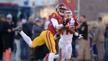 Dec 21, 2013; Las Vegas, NV, USA; Southern California Trojans receiver Marqise Lee (9) is defended by Fresno State Bulldogs safety Derron Smith (13) in the Las Vegas Bowl at Sam Boyd Stadium. USC defeated Fresno State 45-20. Mandatory Credit: Kirby Lee-USA TODAY Sports