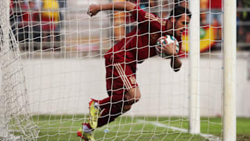 CADIZ, SPAIN - OCTOBER 14: Sandro Ramirez of Spain picks up the ball from the goal after scoring on October 14, 2014 in Cadiz, Spain. (Photo by Sergio Camacho/Getty Images)