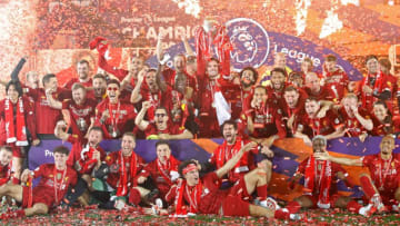 Liverpool lifts Premier League trophy (Photo by PHIL NOBLE/POOL/AFP via Getty Images)