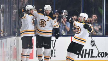 COLUMBUS, OH - MAY 2: David Pastrnak #88 of the Boston Bruins celebrates his first period goal with teammates Patrice Bergeron #37 and Brad Marchand #63 of the Boston Bruins in Game Four of the Eastern Conference Second Round against the Columbus Blue Jackets during the 2019 NHL Stanley Cup Playoffs on May 2, 2019 at Nationwide Arena in Columbus, Ohio. (Photo by Jamie Sabau/NHLI via Getty Images)