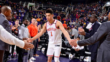 PHOENIX, AZ - DECEMBER 26: Devin Booker #1 of the Phoenix Suns is introduced prior to the game against the Memphis Grizzlies on December 26, 2017 at Talking Stick Resort Arena in Phoenix, Arizona. NOTE TO USER: User expressly acknowledges and agrees that, by downloading and or using this photograph, user is consenting to the terms and conditions of the Getty Images License Agreement. Mandatory Copyright Notice: Copyright 2017 NBAE (Photo by Barry Gossage/NBAE via Getty Images)