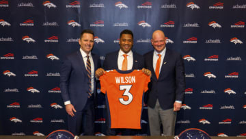 ENGLEWOOD, CO - MARCH 16: Quarterback Russell Wilson #3 of the Denver Broncos poses with his jersey alongside (L) General Manager George Paton and Head Coach Nathaniel Hackett following an introductory press conference at UCHealth Training Center on March 16, 2022 in Englewood, Colorado. (Photo by Justin Edmonds/Getty Images)