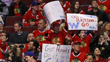 CHICAGO, IL - NOVEMBER 03: Fans hold signs saluting the Chicago Cubs and the Chicago Blackhawks during a game against the Colorado Avalanche at the United Center on November 3, 2016 in Chicago, Illinois. The Blackhawks defeated the Avalanche 4-0. (Photo by Jonathan Daniel/Getty Images)