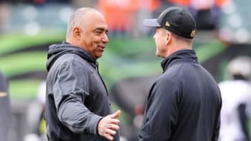 Jan 3, 2016; Cincinnati, OH, USA; Cincinnati Bengals head coach Marvin Lewis talks to Baltimore Ravens head coach John Harbaugh before the game at Paul Brown Stadium. Mandatory Credit: Joshua Lindsey-USA TODAY Sports