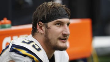 HOUSTON, TX - NOVEMBER 27: Joey Bosa #99 of the San Diego Chargers rests on the bench during the fourth quarter against the Houston Texans at NRG Stadium on November 27, 2016 in Houston, Texas. (Photo by Tim Warner/Getty Images)