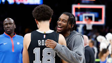 OCK Thunder guard Shai Gilgeous-Alexander (2) meets Spurs forward Isaiah Roby (18) following their game at Paycom Center. Oklahoma City won 119-111. Mandatory Credit: Alonzo Adams-USA TODAY Sports