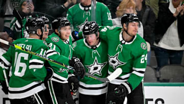 Feb 14, 2023; Dallas, Texas, USA; Dallas Stars left wing Jason Robertson (21) and defenseman Ryan Suter (20) and defenseman Nils Lundkvist (5) and center Roope Hintz (24) and center Joe Pavelski (16) celebrate a goal scored by Robertson against the Boston Bruins during the second period at the American Airlines Center. Mandatory Credit: Jerome Miron-USA TODAY Sports