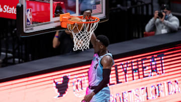 Miami Heat guard Victor Oladipo (4) dunks on a fast break during the first quarter of a game against the Golden State Warriors (Mary Holt-USA TODAY Sports)