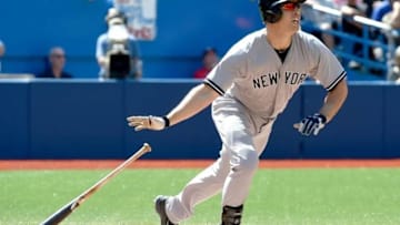 Aug 15, 2015; Toronto, Ontario, CAN; New York Yankees designated hitter Mark Teixeira (25) hits a home run against Toronto Blue Jays in the sixth inning at Rogers Centre. Mandatory Credit: Dan Hamilton-USA TODAY Sports