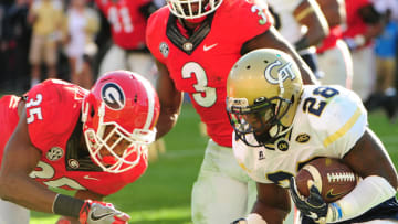 ATHENS, GA - NOVEMBER 26: J. J. Green #28 of the Georgia Tech Yellow Jackets gets set for a collision with Georgia football defender Aaron Davis #35 at Sanford Stadium on November 26, 2016 in Athens, Georgia. (Photo by Scott Cunningham/Getty Images)