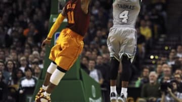Jan 13, 2016; Boston, MA, USA; Boston Celtics guard Isaiah Thomas (4) shoots the ball past the reach of Indiana Pacers guard Monta Ellis (11) during the second half at TD Garden. Mandatory Credit: Bob DeChiara-USA TODAY Sports