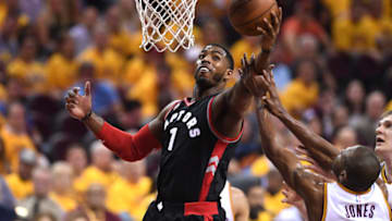 CLEVELAND, OH - MAY 25: Jason Thompson #1 of the Toronto Raptors gets a rebound in the fourth quarter against James Jones #1 of the Cleveland Cavaliers in game five of the Eastern Conference Finals during the 2016 NBA Playoffs at Quicken Loans Arena on May 25, 2016 in Cleveland, Ohio. NOTE TO USER: User expressly acknowledges and agrees that, by downloading and or using this photograph, User is consenting to the terms and conditions of the Getty Images License Agreement. (Photo by Jason Miller/Getty Images)