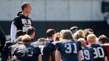 Bearcats head coach Luke Fickell wraps up practice during training camp. The Enquirer.